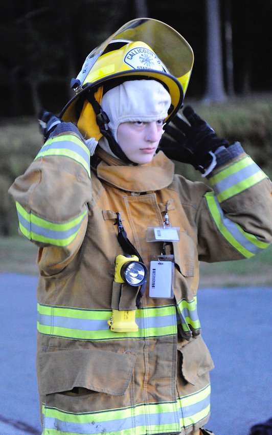 Tabitha Homenick, 21, is a member of the Upper Delaware Volunteer Ambulance Corps and a new recruit in the Callicoon Fire Department. She is pictured participating in a training exercise at the Sullivan County Emergencies Training Center. The exercise was conducted by NYS Fire Instructor Tom Dempsey Sr., who put the students through their paces in getting into full turnout gear in less than a minute.